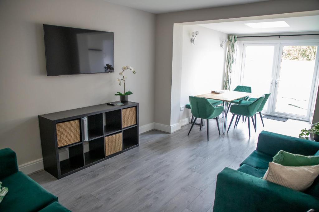 a living room with a couch and a table at Wave Stays - Ground Floor Apartment in Cleveleys
