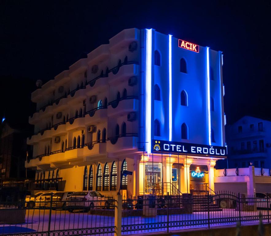a lit up building with a lit up sign on it at Eroglu City Hotel in Fethiye