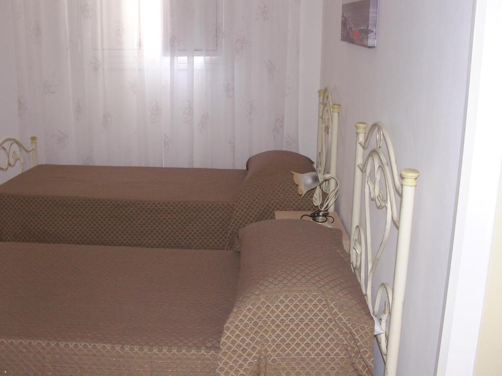 Postel nebo postele na pokoji v ubytování Don Nicola Residence
