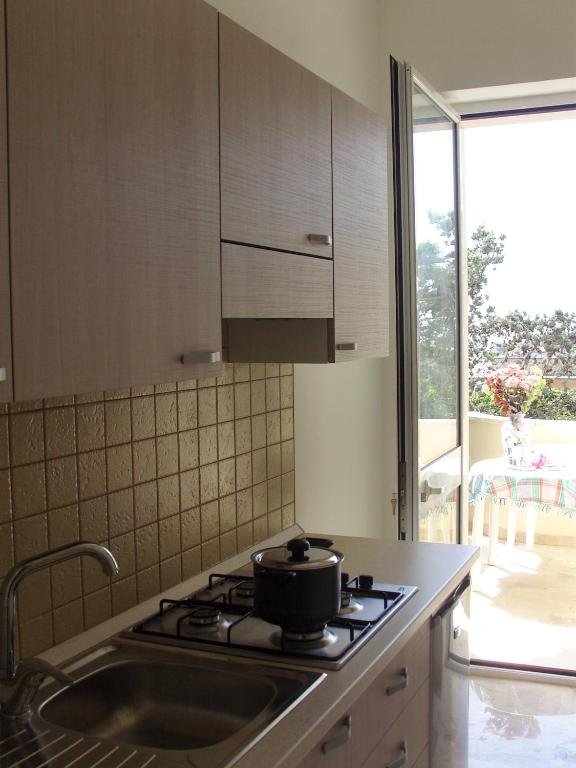 Kuchyň nebo kuchyňský kout v ubytování Don Nicola Residence