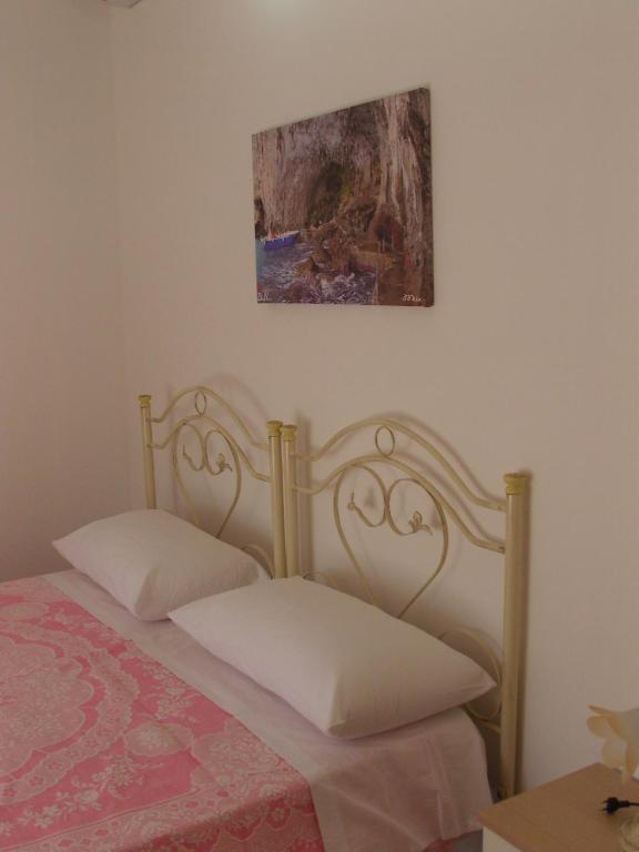 Postel nebo postele na pokoji v ubytování Don Nicola Residence