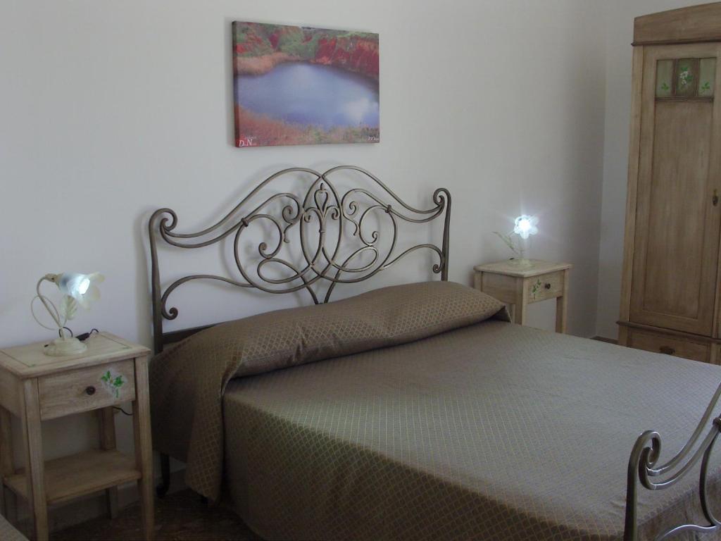 Postel nebo postele na pokoji v ubytování Don Nicola Residence