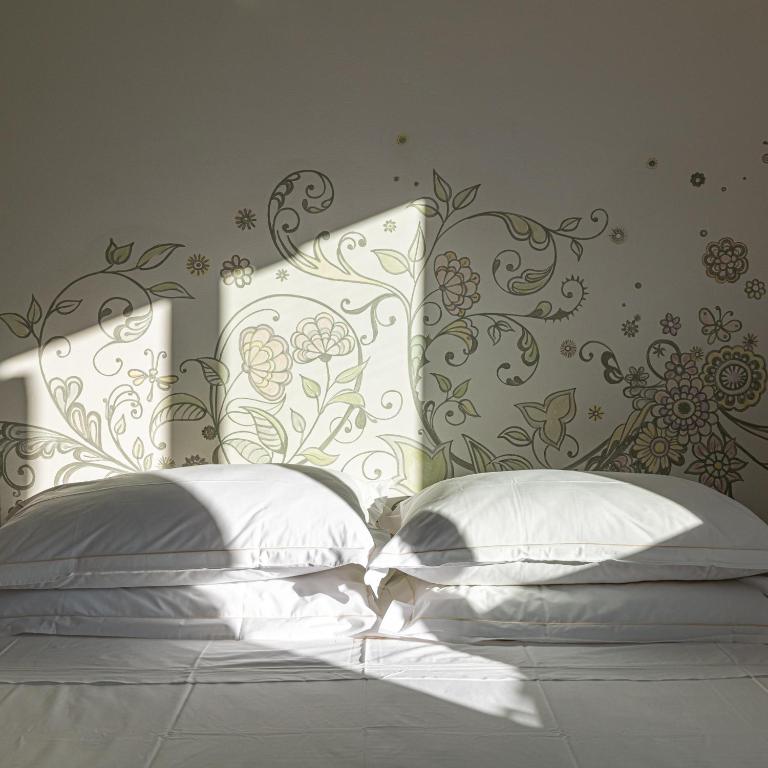 Ein Bett oder Betten in einem Zimmer der Unterkunft Albergo Minerva