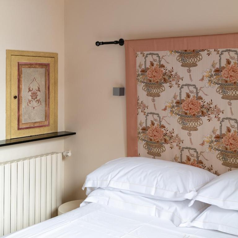 Ein Bett oder Betten in einem Zimmer der Unterkunft Albergo Minerva