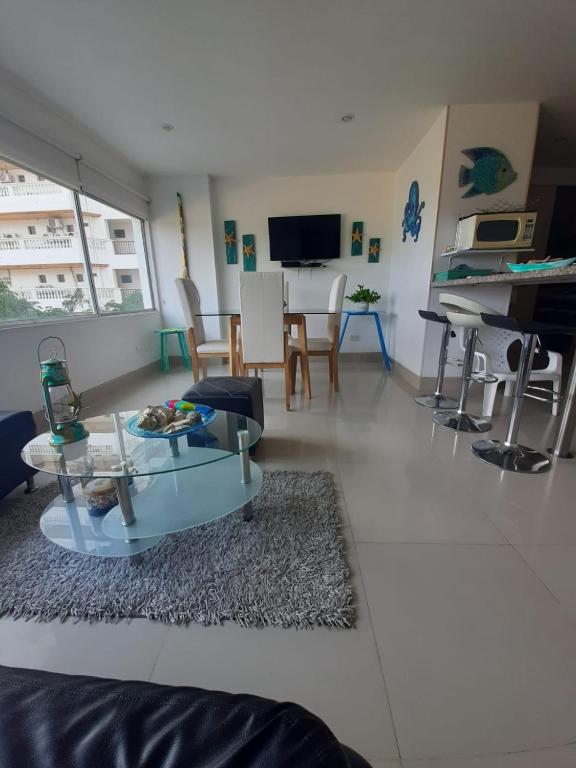 a living room with a couch and a table at Bello Horizonte * Unido Al Mar in Santa Marta