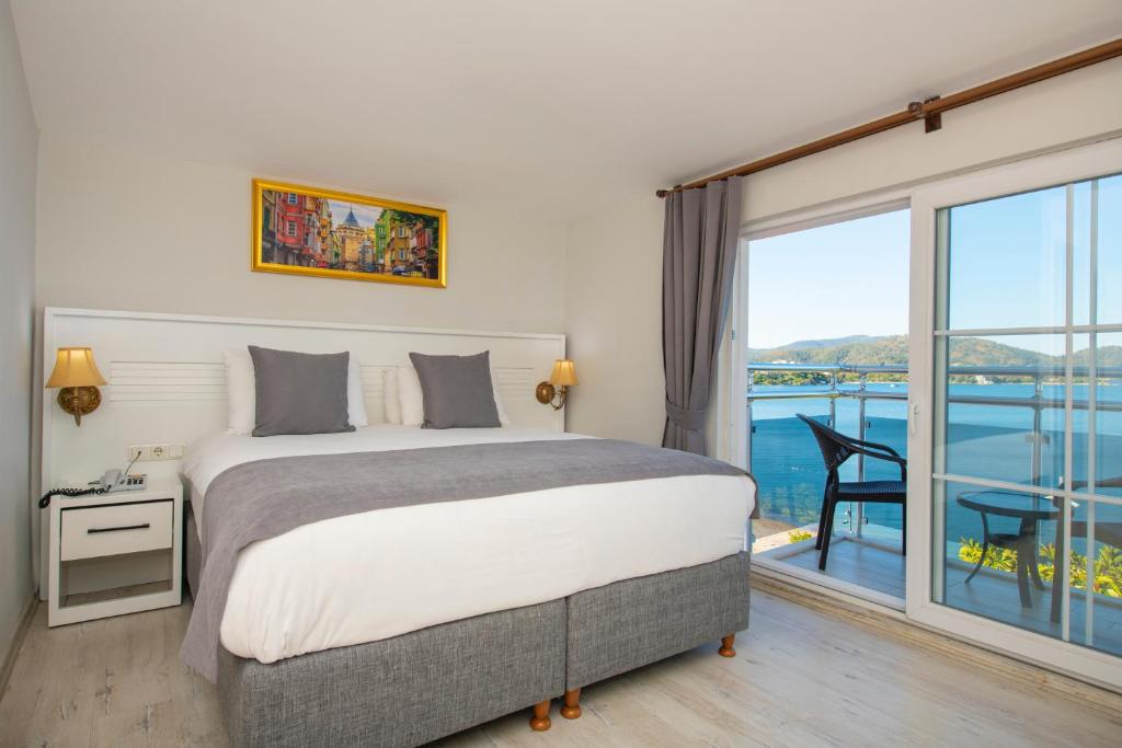 Postel nebo postele na pokoji v ubytování Mia Casa Hotel