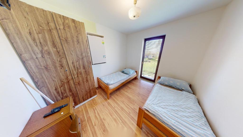 Postel nebo postele na pokoji v ubytování U MIRASE Heřmaničky