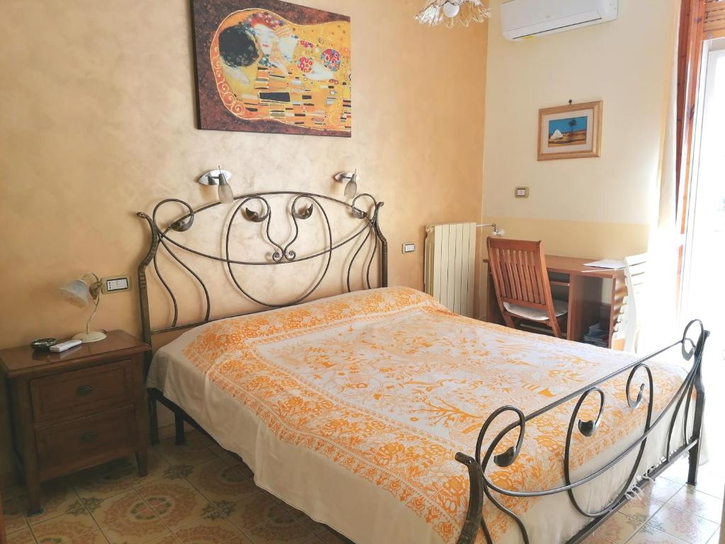 B&B Il Giardinetto Alghero tesisinde bir odada yatak veya yataklar