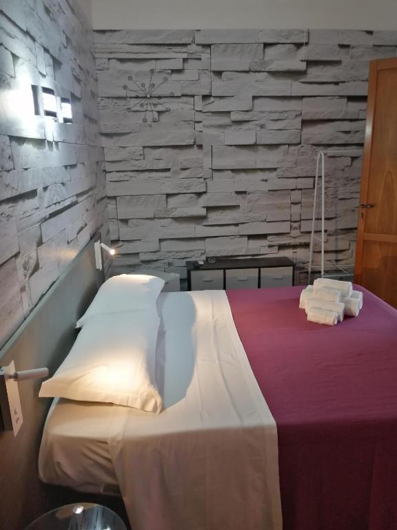 Posteľ alebo postele v izbe v ubytovaní Le Rocce Holiday Rooms