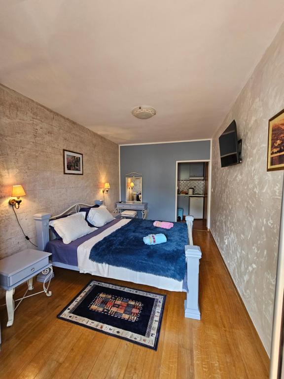Postel nebo postele na pokoji v ubytování Medin Apartments BluVista