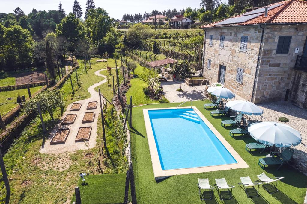 an aerial view of a villa with a swimming pool at Casa Rio Contença T5 in Carvalhais