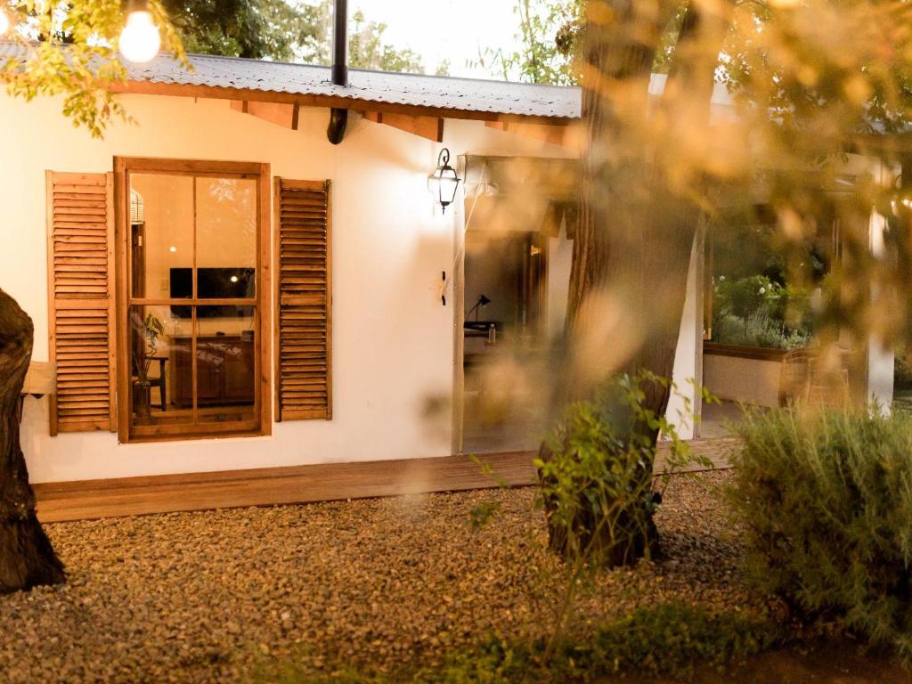 a house with a door and a window at Olyf guestcottage in Bloemfontein