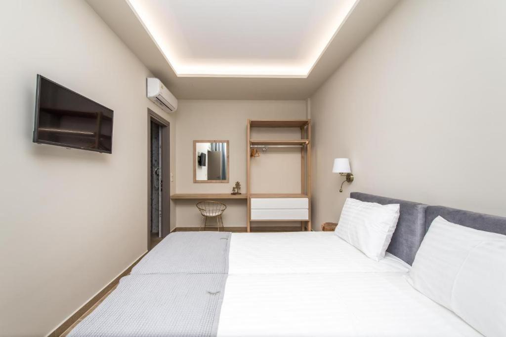 Posteľ alebo postele v izbe v ubytovaní Pietra Caves Suites