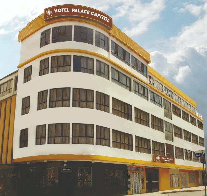 a hotel building with a sign on top of it at Hotel Palace Capitol in Cochabamba