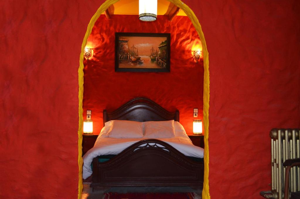 Postel nebo postele na pokoji v ubytování Hotel Sahara