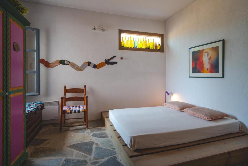 A bed or beds in a room at Kea Boho Luxury with Pool & Stunning Views