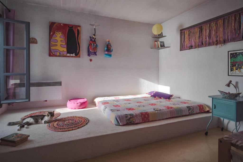 A bed or beds in a room at Kea Boho Luxury with Pool & Stunning Views