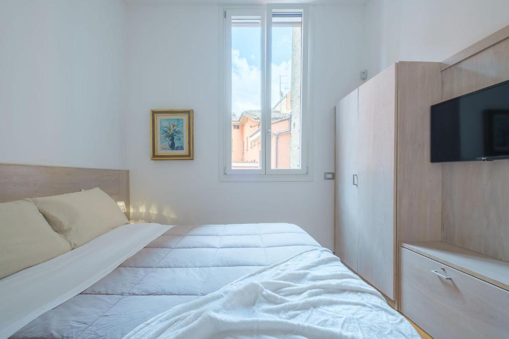 Posteľ alebo postele v izbe v ubytovaní D'Azeglio & Galluzzi Suites