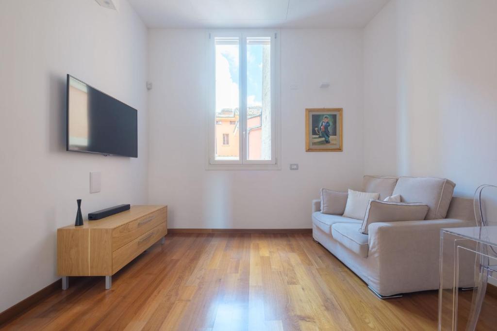 Televízia a/alebo spoločenská miestnosť v ubytovaní D'Azeglio & Galluzzi Suites