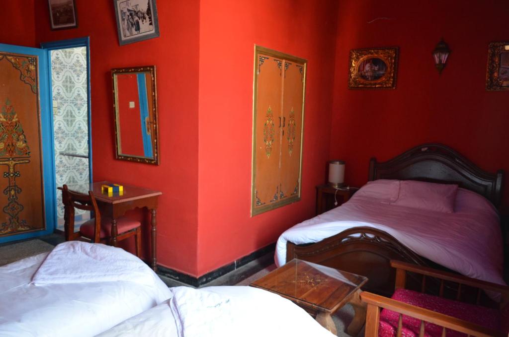 Postel nebo postele na pokoji v ubytování Hotel Sahara