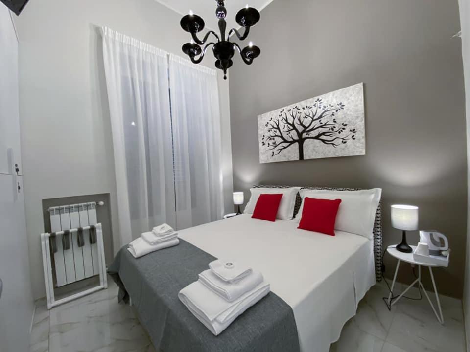 Łóżko lub łóżka w pokoju w obiekcie La Fitolacca B&B