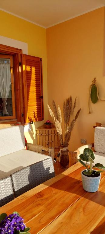 A seating area at Dimora Pintau in residence con piscina privata