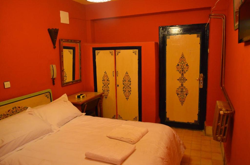 Postel nebo postele na pokoji v ubytování Hotel Sahara
