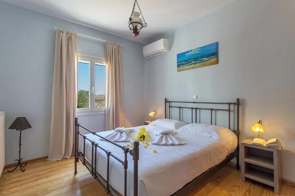 A bed or beds in a room at SAIL VILLA