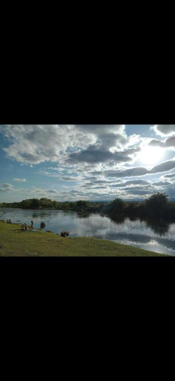 a view of a body of water with a cloudy sky at La Quina. in Villa Rumipal