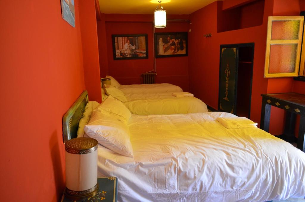 Postel nebo postele na pokoji v ubytování Hotel Sahara