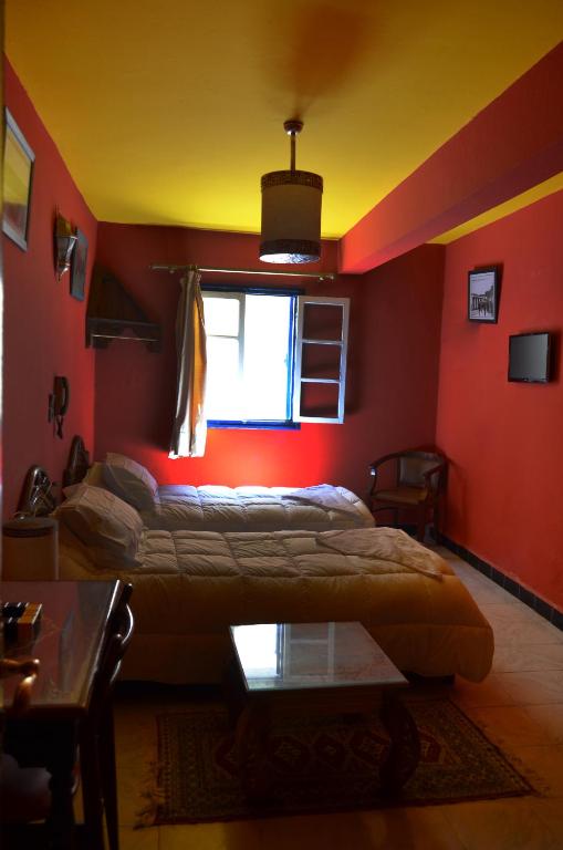 Postel nebo postele na pokoji v ubytování Hotel Sahara