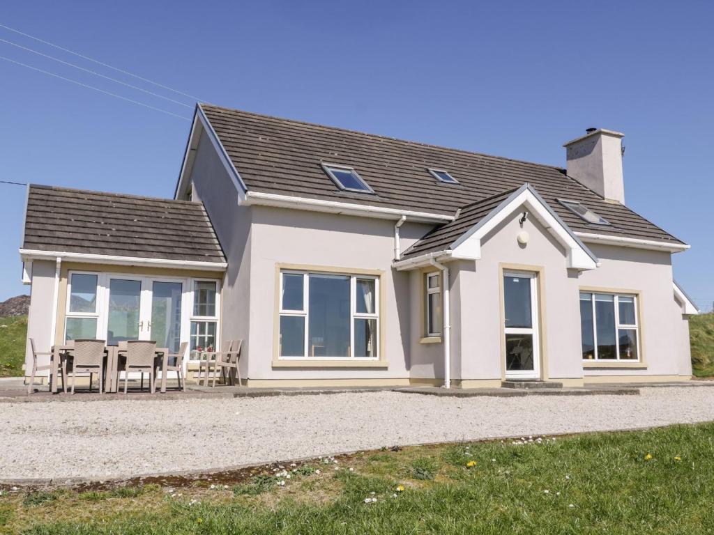 a detached house with a pitched roof at Inverbeg Cottage 1 in Downings