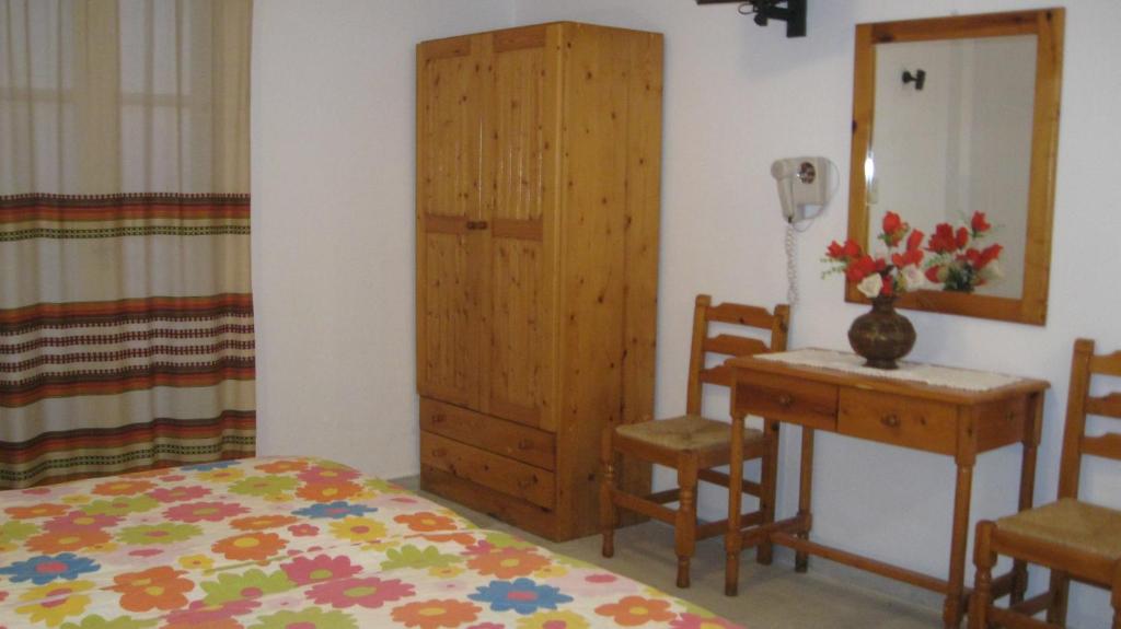 Postel nebo postele na pokoji v ubytování Aronis Plaka Naxos