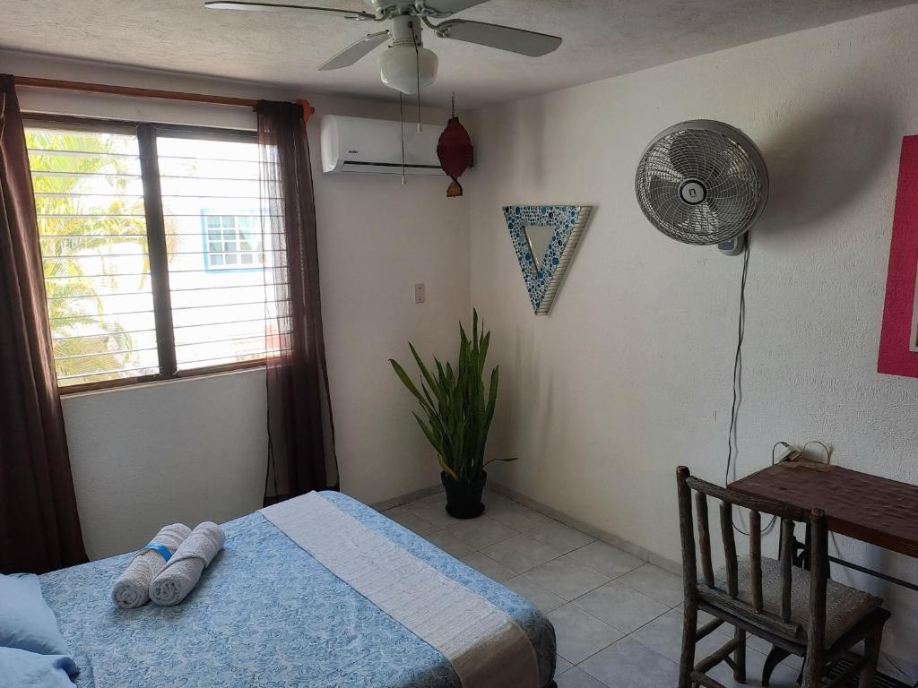 Postel nebo postele na pokoji v ubytování Tu Casa en el Caribe