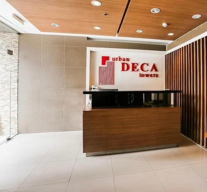 a lobby with a sign for a hotel decca lovers at Arkisha’s Cozy Place in Manila