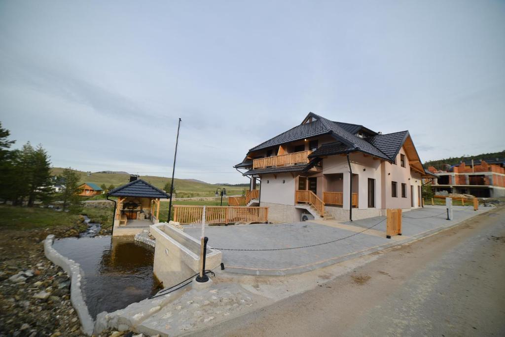 a house that is being built with a driveway at Gold Gondola Premium Apartments in Ribnica