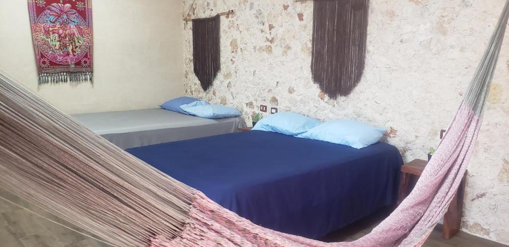 Postel nebo postele na pokoji v ubytování Casa los Jarochos