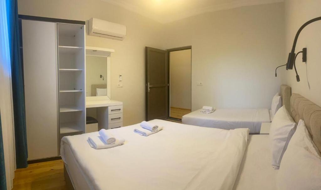 Postel nebo postele na pokoji v ubytování Palm Konak Hotel