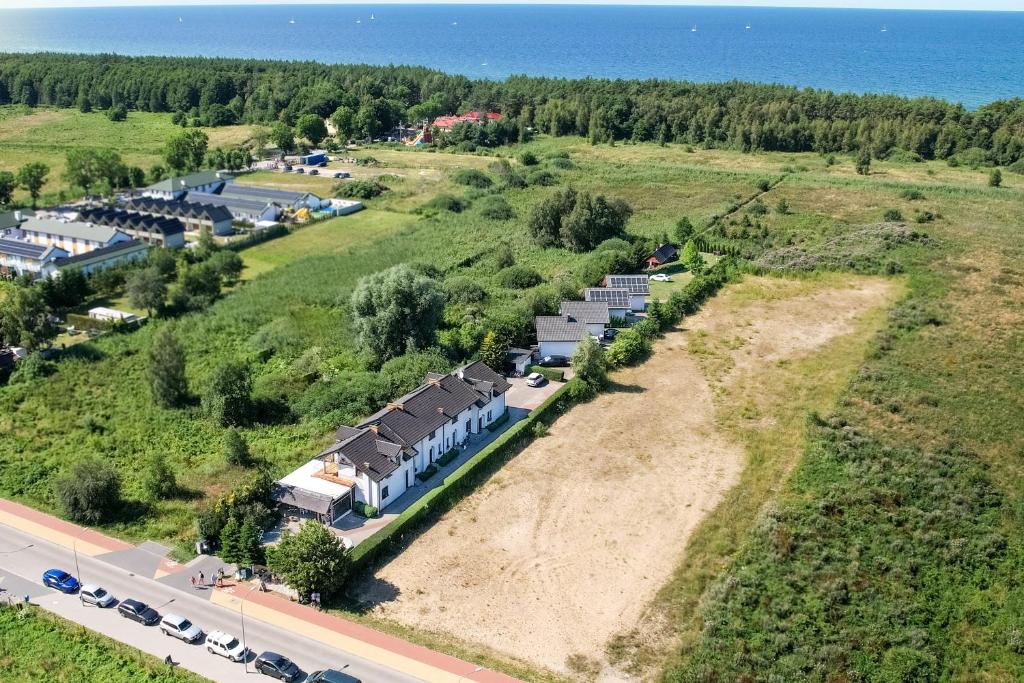 an aerial view of a house on the side of a road at Domki Letniskowe in Grzybowo