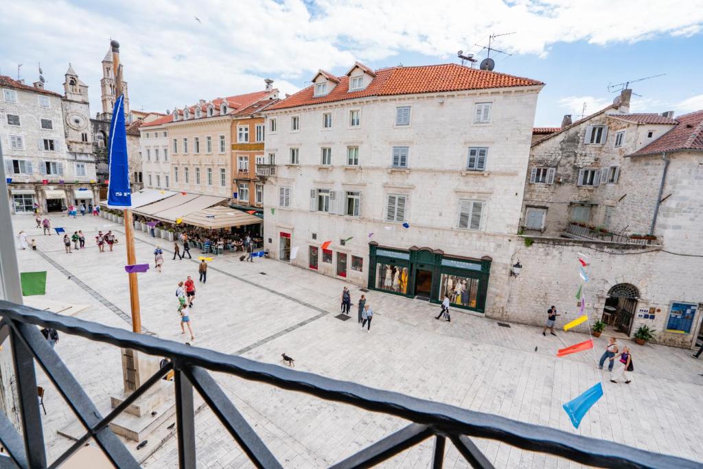 a group of people walking around a city plaza at Luxury Rooms Lucija and Luka in Split