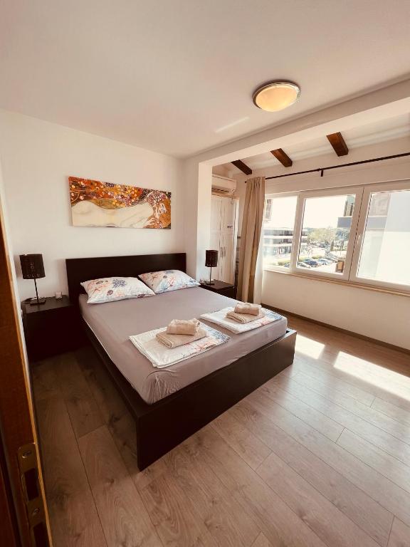 A bed or beds in a room at Apartman Bijeca - Medulin