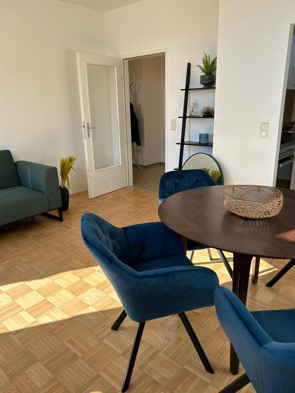 a living room with a table and chairs at Gamlitz - RaStra Top 20 in Gamlitz
