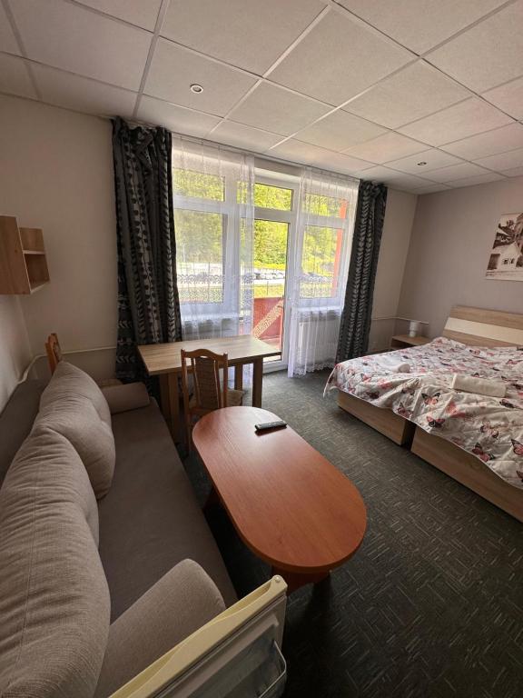 A bed or beds in a room at Penzión Michaela Vyhne