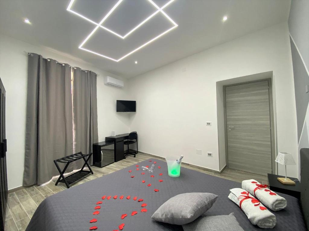 a bedroom with a bed with red hearts on it at Guest Amatur in Ercolano