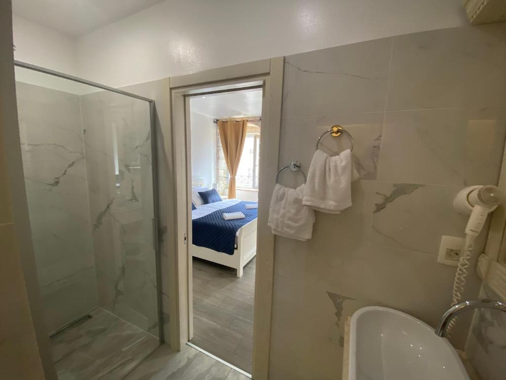 a bathroom with a shower and a sink and a toilet at Luxury Rooms Lucija and Luka in Split