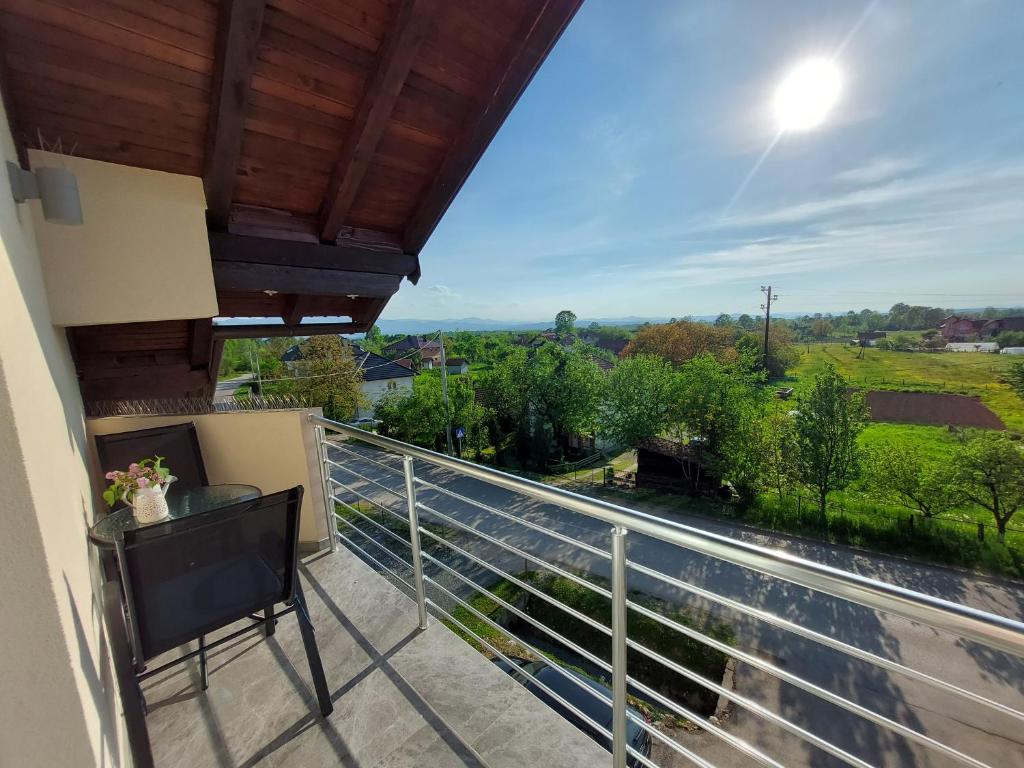 a balcony with a view of the countryside at Apartman Halilčević in Dubrave Gornje
