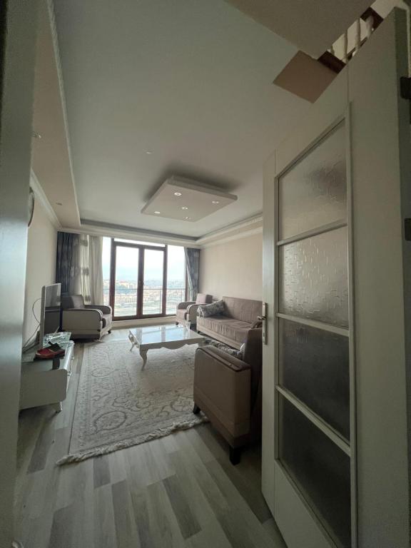 a living room with a couch and a table at Golden horn view apartment 2 in Istanbul
