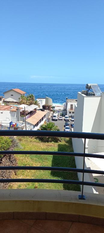 a view of the ocean from a balcony at Costa Azul in Porto Moniz