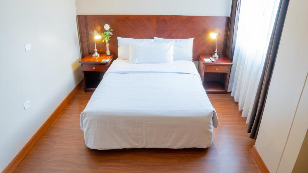 Postel nebo postele na pokoji v ubytování Fenix Hotel