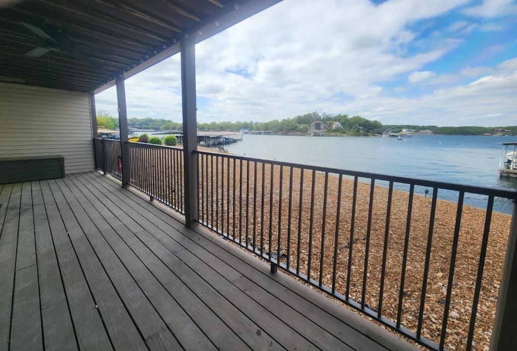 a balcony of a house with a view of the water at Lakefront condo with a VIEW Osage Beach in Osage Beach